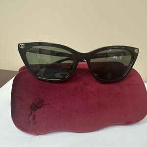 Gucci Black Cat-Eye Sunglasses with Gold Accents